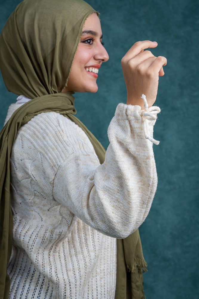 سويتر صوف تركواز بنقشات بسيطة