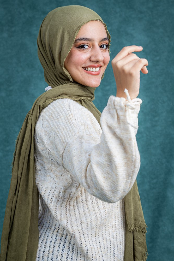 سويتر صوف تركواز بنقشات بسيطة